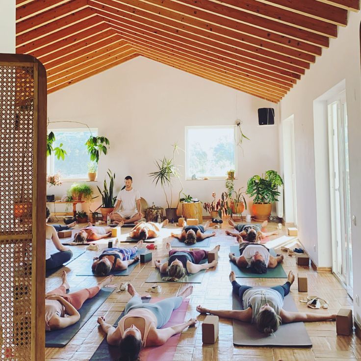 Group breathwork practice in a warm studio