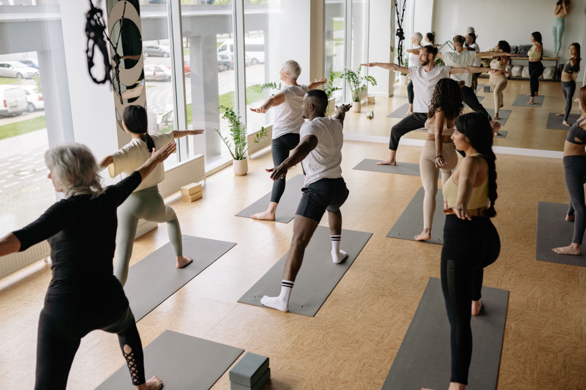 Group yoga class in a bright studio